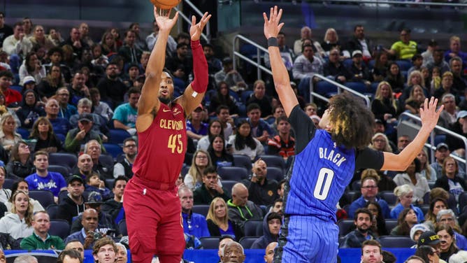 Cleveland Cavaliers SG Donovan Mitchell shoots it over Magic SG Anthony Black during an NBA Game at Amway Center in Orlando, Florida.