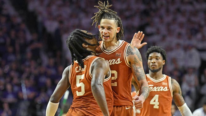 Texas Longhorns PF Christian Bishop and PG Marcus Carr celebrate after beating the Kansas State Wildcats 69-66 at Bramlage Coliseum in Manhattan, Kansas.
