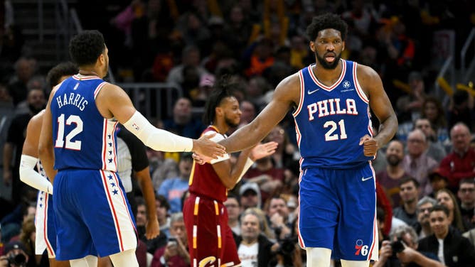 Philadelphia 76ers SF Tobias Harris and C Joel Embiid high-five during the 4th quarter against the Cleveland Cavaliers at Rocket Mortgage Fieldhouse in Cleveland, Ohio.
