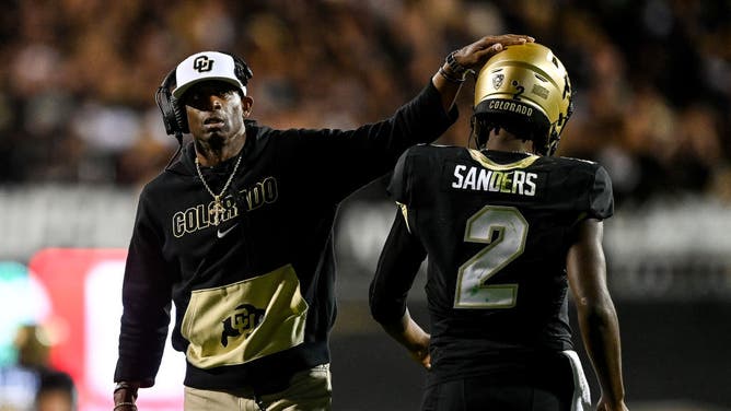 Colorado coach Deion Sanders and QB Shedeur Sanders after a 4th quarter TD vs. the Colorado State Rams at Folsom Field in Boulder.
