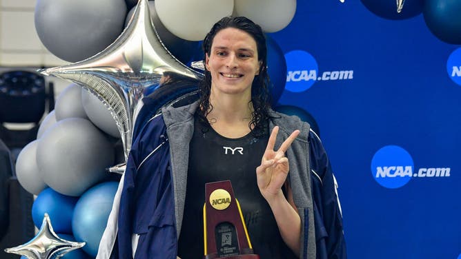 University of Pennsylvania swimmer Lia Thomas accepts the winning trophy for the 500 Freestyle finals during the NCAA Swimming and Diving Championships on March 17th, 2022 at the McAuley Aquatic Center in Atlanta Georgia.
