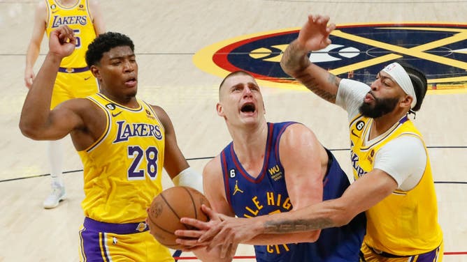 Denver Nuggets C Nikola Jokic is fouled by Los Angeles Lakers PF Anthony Davis in Game 1 of the NBA Western Conference Finals at Ball Arena.