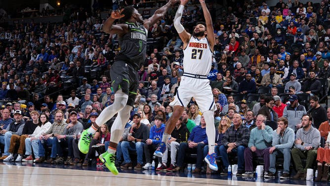Nuggets PG Jamal Murray shoots a 3-pointer vs. the Timberwolves at the Ball Arena in Denver, Colorado.
