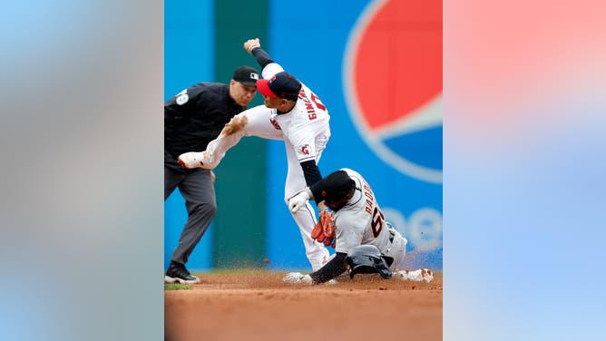 Andres Gimenez of the Cleveland Guardians tags out Akil Baddoo of the Detroit Tigers as he attempts to steal second base during the second inning at Progressive Field on May 08, 2023 in Cleveland, Ohio.