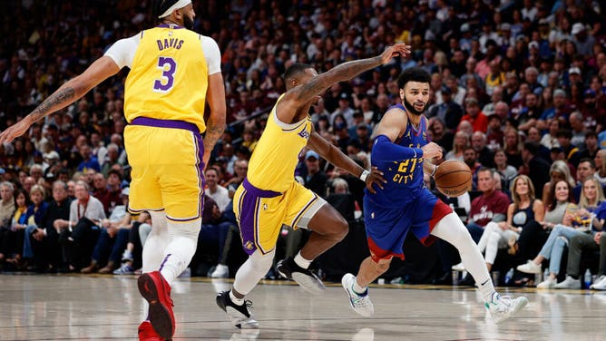 Nuggets PG Jamal Murray controls the ball against LA Lakers G Lonnie Walker IV during Game 1 of the Western Conference Finals.