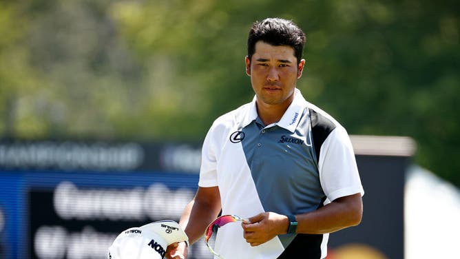 Hideki Matsuyama looks on from the 9th green during the 2nd round of the 2022 Wyndham Championship at Sedgefield.