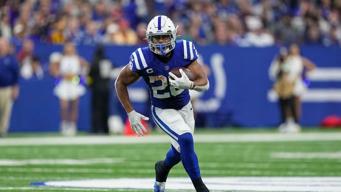 Indianapolis Colts RB Jonathan Taylor runs with the ball in the 3rd quarter against the Washington Commanders at Lucas Oil Stadium in Indianapolis, Indiana.