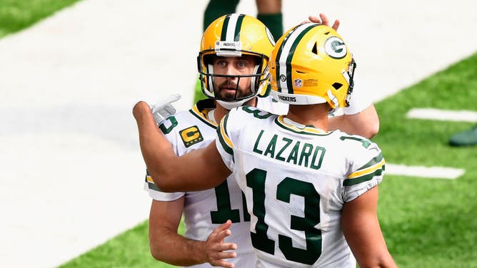 Aaron Rodgers and Allen Lazard celebrate a TD against the Minnesota Vikings in Minneapolis.