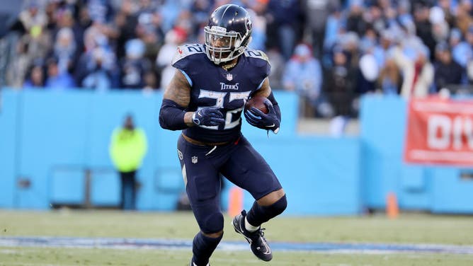 Tennessee Titans Derrick Henry carries the ball against the Cincinnati Bengals in the AFC Divisional Playoff game at Nissan Stadium in Nashville, Tennessee.