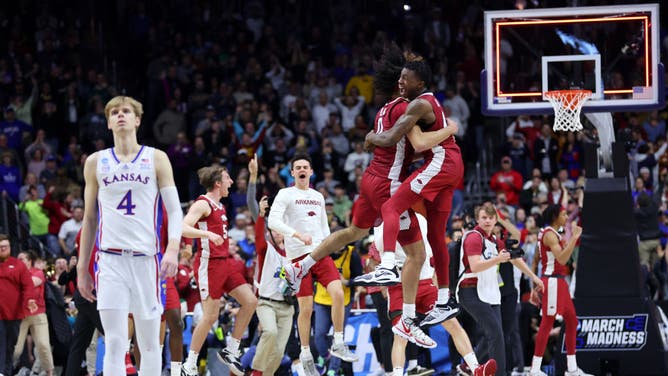 Arkansas players celebrate the win over Kansas in the NCAA Tournament