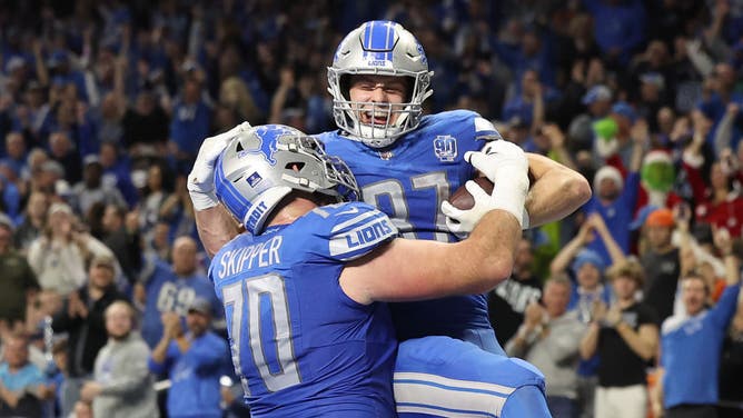 Sam LaPorta of the Detroit Lions celebrates his touchdown catch with Dan Skipper during a win over the Denver Broncos at Ford Field.
