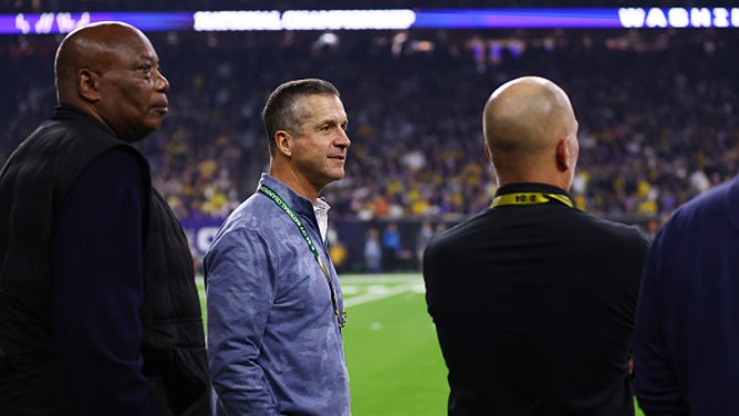 John Harbaugh Surprises Brother Jim Harbaugh At National Championship Game