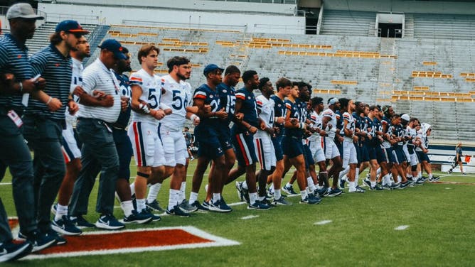 Virginia players honor their fallen teammates with a beautiful tribute on Saturday. Courtesy of Virginia Athletics