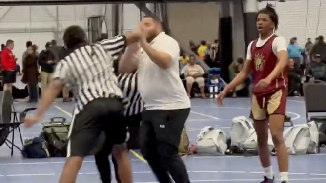 37957944-AAU-coach-ref-trade-punches