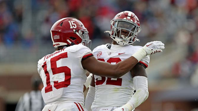 Dallas Turner of the Alabama Crimson Tide and Deontae Lawson celebrate after a play against Ole Miss.