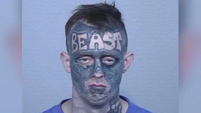 Beast face tattoo