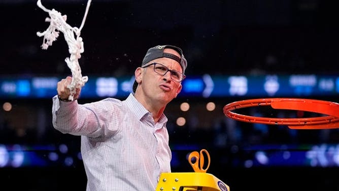 Connecticut head coach Dan Hurley celebrates during the net cutting after beating San Diego State in the NCAA Tournament on Monday, April 3, 2023, in Houston.