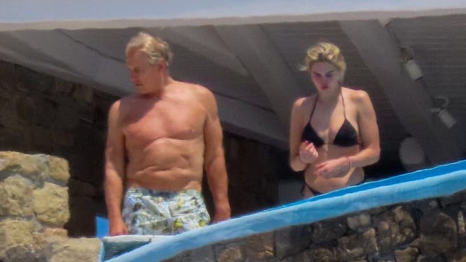 Actor Dolph Lundgren and his fiancee enjoy vacation in Greece.