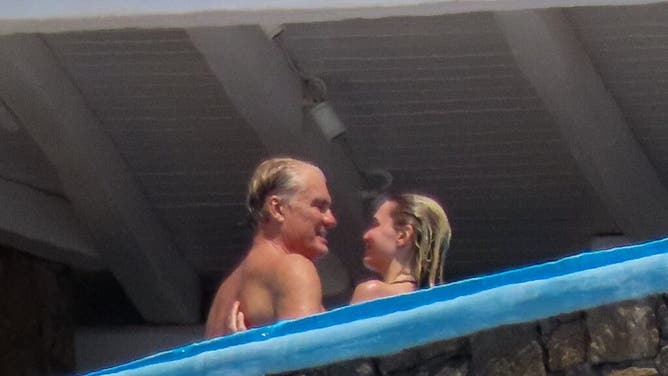 Dolph Lundgren goes shirtless during romantic Greek vacation with much younger fiancee Emma Krokdal amid his lung cancer battle.