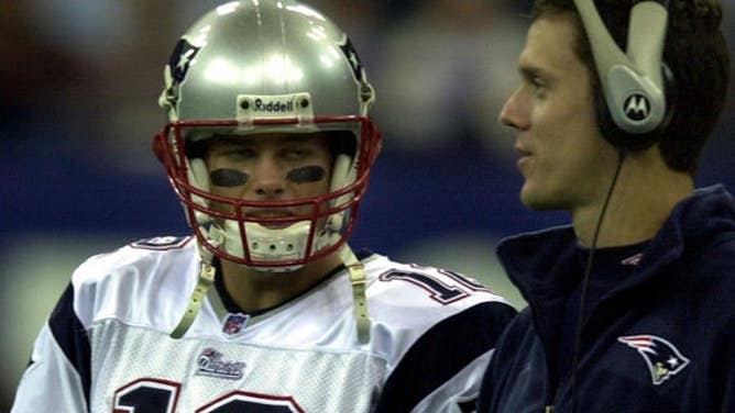 Patriots Tom Brady getting some pre-game advice from Drew Bledsoe at the RCA Dome.