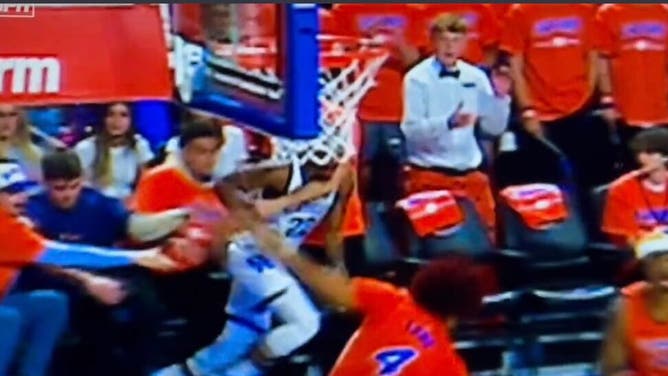 Florida Fan Puts Kentucky Player In Hook & Hold
