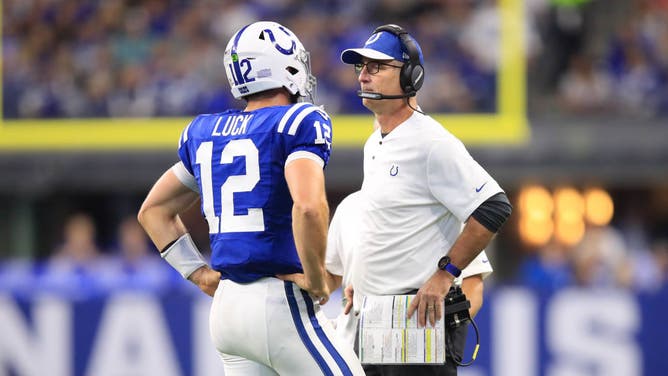 Former Colts QB Andrew Luck talks with Reich at Lucas Oil Stadium in Indianapolis.