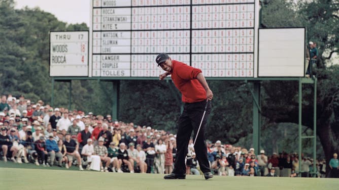 Tiger Woods celebrates after sinking a 4-feet putt to win the 1997 Masters at the Augusta National Golf Club in Georgia.