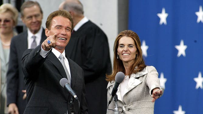 Schwarzenegger and Shriver greet the crowd after Arnold was sworn-in as the 38th governor of California at the State Capitol Building in Sacramento November 17, 2003.
