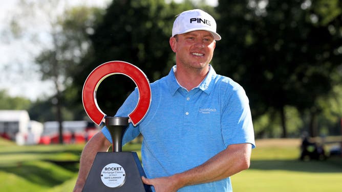 Nate Lashley celebrates with the trophy after winning the 2019 Rocket Mortgage Classic at the Detroit Country Club.
