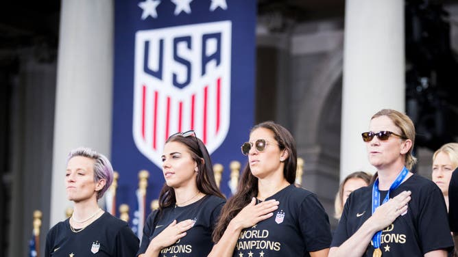 US Women's National Team player Megan Rapinoe hates standing during the American National Anthem even as teammates Alex Morgan and Carli Lloyd and head coach Jill Ellis show their respect to the country that gave them everything they have.