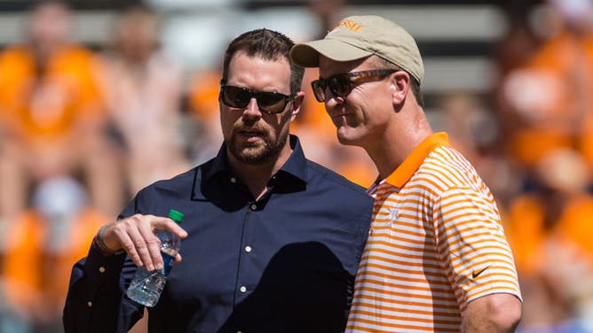 Peyton Manning and Ryan Leaf talk prior to a college football game in 2019. The pair will be forever linked because of the 1998 NFL Draft, though their paths since that day have gone in very different directions.