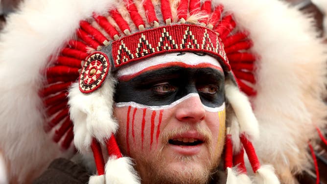 A fan in a headdress looks on prior to the AFC Divisional playoff game between the Kansas City Chiefs and the Houston Texans at Arrowhead Stadium on January 12, 2020 in Kansas City, Missouri.