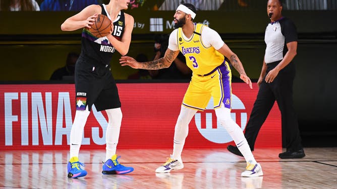 Lakers' Anthony Davis defends Nuggets' Nikola Jokic during 2020 Western Conference Finals in Orlando, Florida at AdventHealth Arena.