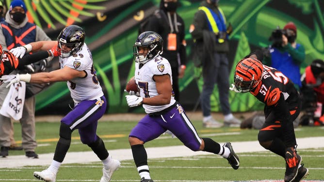 Baltimore Ravens RB J.K. Dobbins carries the ball against the Baltimore Ravens at Paul Brown Stadium in Cincinnati, Ohio.