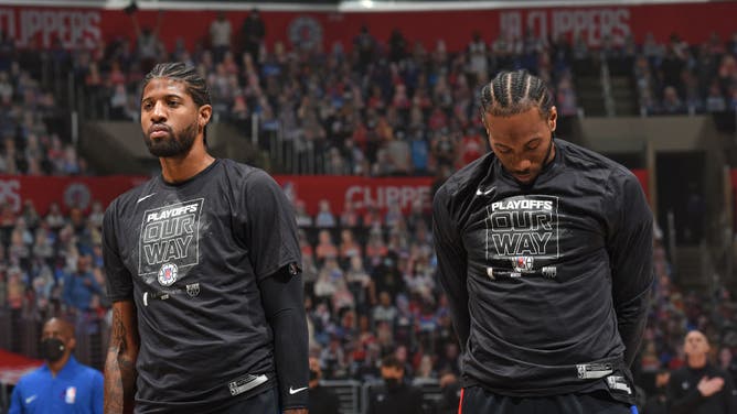 Los Angeles Clippers wings Paul George and Kawhi Leonard look on before the game against the Dallas Mavericks at STAPLES Center in Los Angeles.