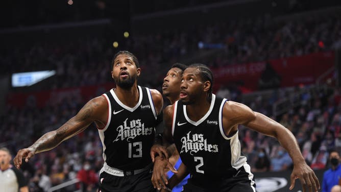 LA Clippers wings Paul George and Kawhi Leonard play defense against the Dallas Mavericks during Round 1, Game 7 of the 2021 NBA Playoffs at STAPLES Center in Los Angeles.