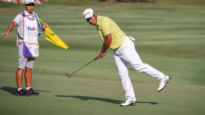 Hideki Matsuyama reacts to his putt at the 18th green during the 1st playoff hole in the final round of the World Golf Championships-FedEx St. Jude Invitational at TPC Southwind.