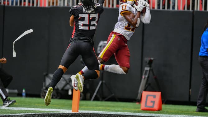 Washington Commanders WR Terry McLaurin catches a TD pass while defended by Atlanta Falcons FS Erik Harris last season at Mercedes-Benz Stadium in Atlanta.