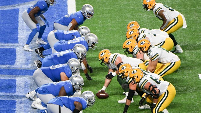 The Detroit Lions defense lines up at the goal line against Green Bay Packers QB Aaron Rodgers and the offense at Ford Field in Detroit.