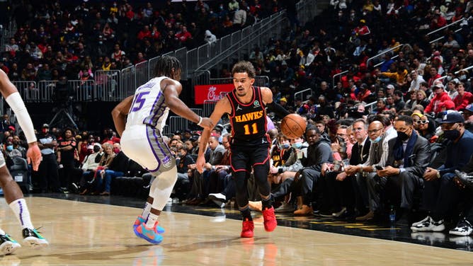 Atlanta Hawks PG Trae Young dribbles the ball during the game against the Sacramento Kings at State Farm Arena in Atlanta.
