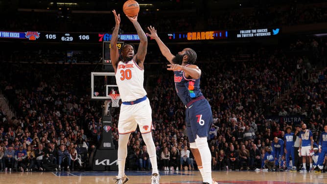New York Knicks PF Julius Randle shoots over Philadelphia 76ers SG James Harden at Madison Square Garden.