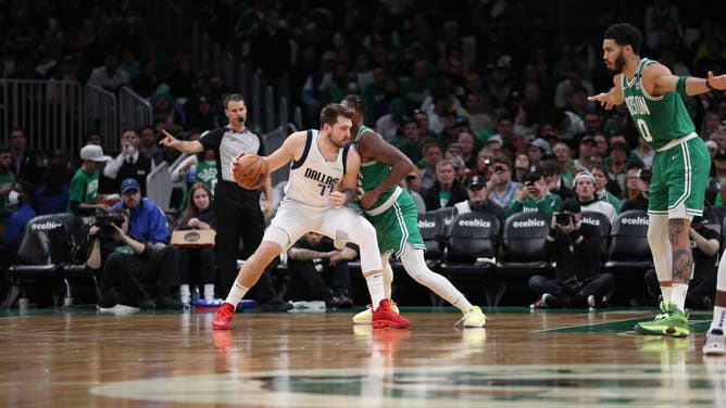 Dallas Mavericks wing Luka Doncic handles the ball during the game against the Boston Celtics at the TD Garden in Boston.