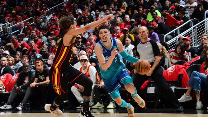 Charlotte Hornets' LaMelo Ball drives to the basket against the Atlanta Hawks during the 2022 Play-In Tournament at State Farm Arena in Atlanta.
