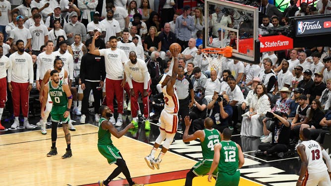 Heat wing Jimmy Butler drives to the hoop on the Celtics during Game 7 of the 2022 NBA Playoffs Eastern Conference Finals at the FTX Arena in Miami.