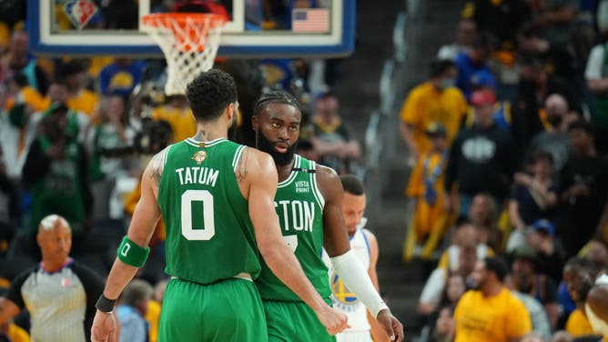 Boston Celtics All-Star Jayson Tatum chest bumps Jaylen Brown during Game 1 of the 2022 NBA Finals at Chase Center in San Francisco.