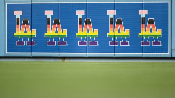 LA Pride Group Pulls Out Of Dodgers' Pride Night Over Drag Nun Decision, MLB logo