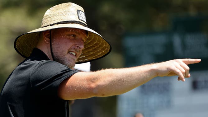 ESPN commentator Pat McAfee points towards fans while walking on the 18th fairway during Round One of the 2022 American Century Championship at Edgewood Tahoe Golf Course.