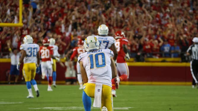 Chargers QB Justin Herbert watches as the Chiefs return his interception for a touchdown earlier this season.