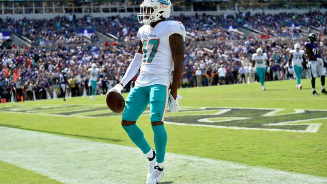Miami Dolphins WR Jaylen Waddle celebrates after scoring a TD vs. the Ravens at M&T Bank Stadium in Baltimore, Maryland.