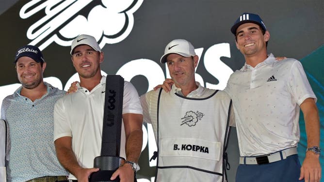 Brooks Koepka celebrates on the podium with his team following his play-off win in the LIV Tour Invitational-Jeddah at the Royal Greens Golf Club.